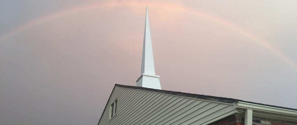 Rainbow Over Church Building